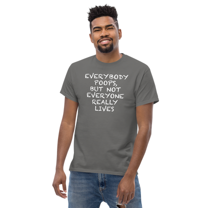 "Everybody poops, but not everyone really lives" printed on a charcoal unisex classic tee worn by a male