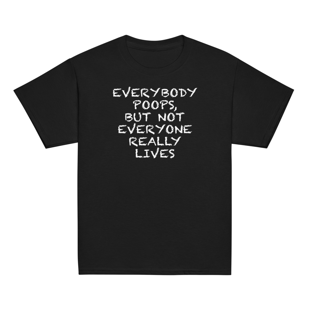 "Everybody poops, but not everyone really lives" printed on a black youth classic tee laying on a flat surface
