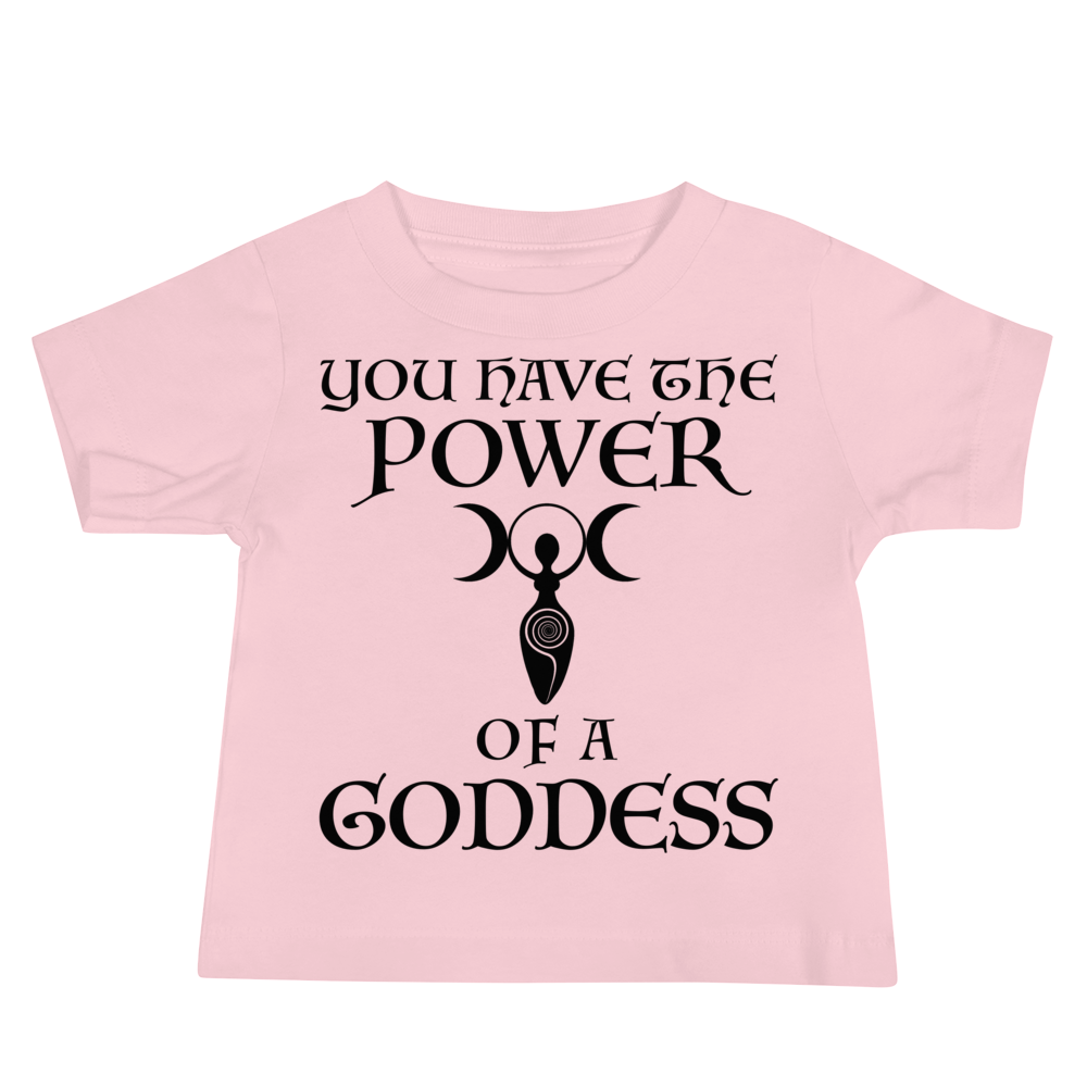 "You have the power of a goddess" printed on a pink baby jersey short sleeve tee laying on a flat surface