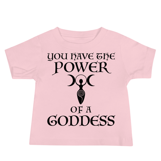 "You have the power of a goddess" printed on a pink baby jersey short sleeve tee laying on a flat surface