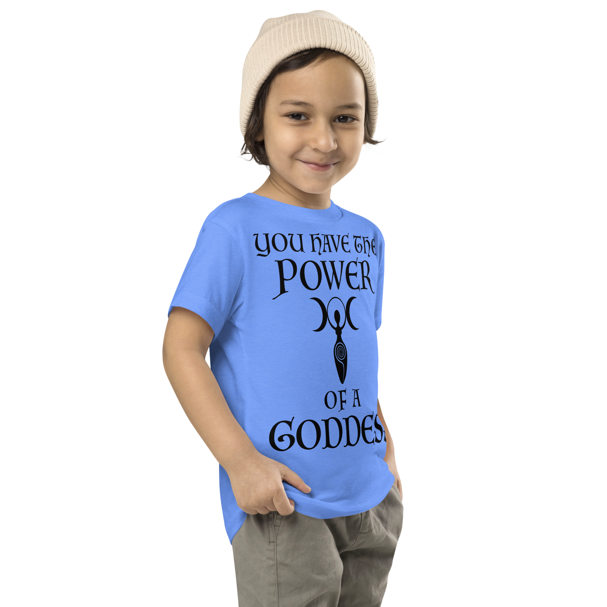 "You have the power of a goddess" printed on a heather columbia blue toddler short sleeve tee worn by a male who is also wearing a knit cap