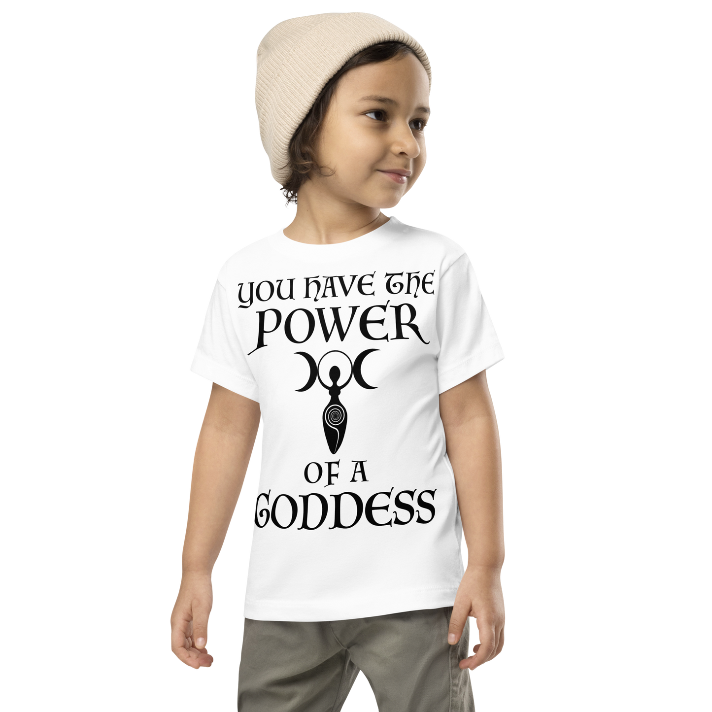 "You have the power of a goddess" printed on a white toddler short sleeve tee worn by a male wearing a cap