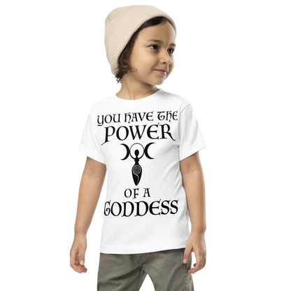 "You have the power of a goddess" printed on a white toddler short sleeve tee worn by a male wearing a cap