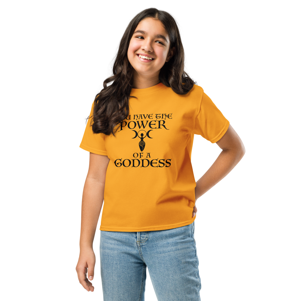 "You have the power of a goddess" printed on a gold youth classic tee worn by a female