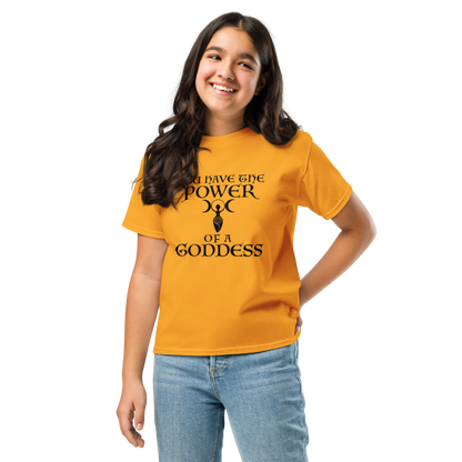 "You have the power of a goddess" printed on a gold youth classic tee worn by a female