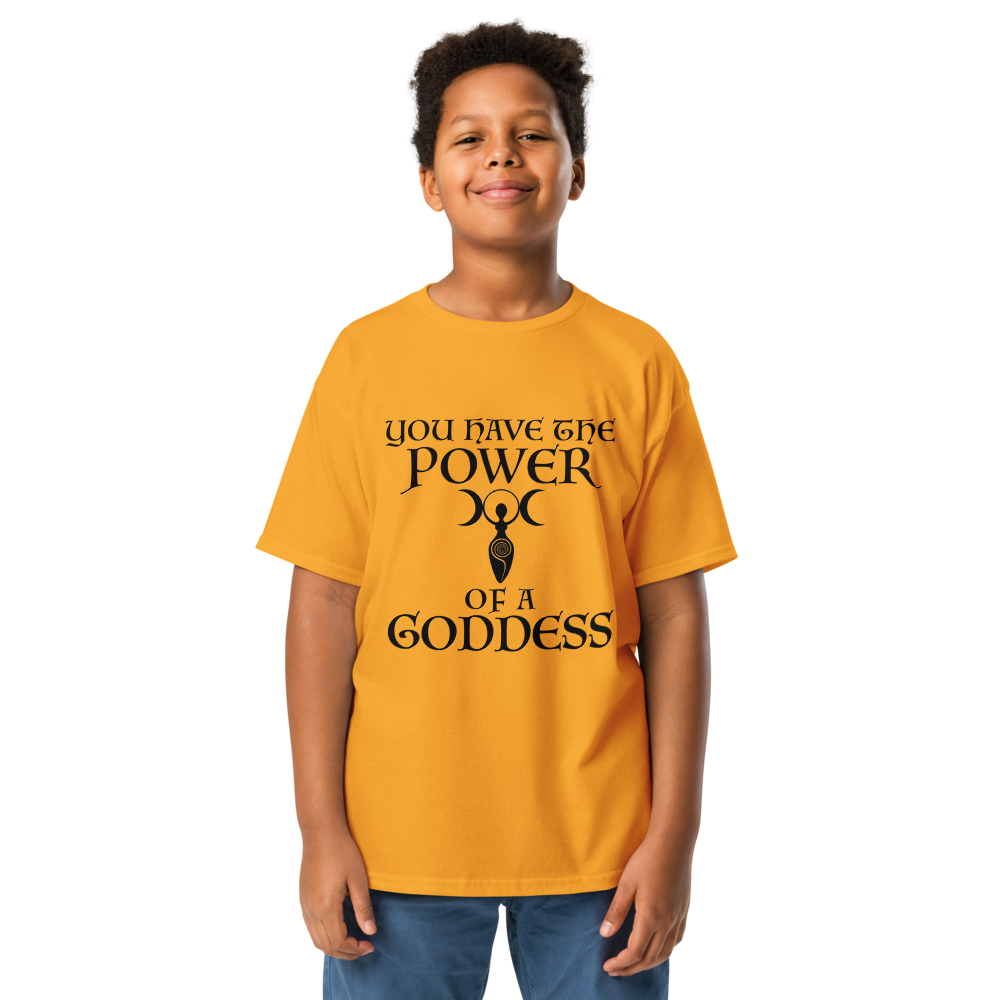 "You have the power of a goddess" printed on a gold youth classic tee worn by a male