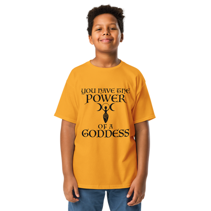 "You have the power of a goddess" printed on a gold youth classic tee worn by a male