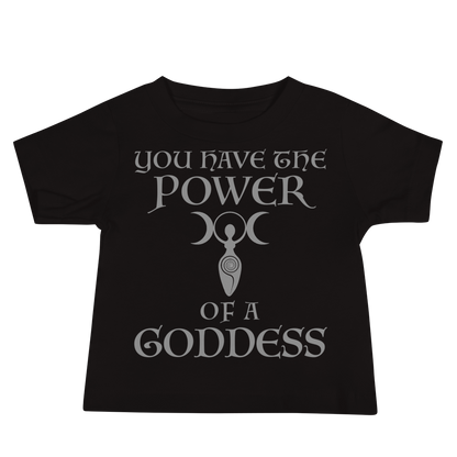 "You have the power of a goddess" printed on a black baby jersey short sleeve tee laying on a flat surface