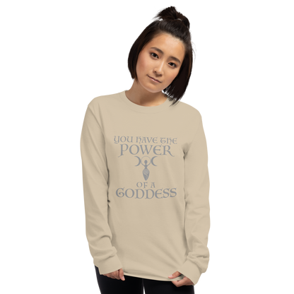 "You have the power of a goddess" printed on a sand men's long sleeve shirt worn by a female