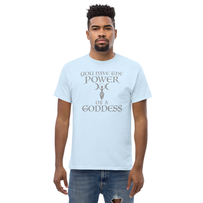 "You have the power of a goddess" printed on a light blue unisex classic tee worn by a male