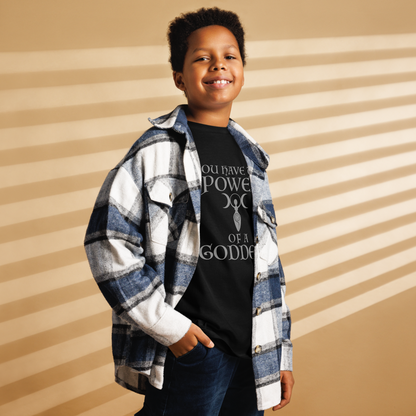 "You have the power of a goddess" printed on a black youth classic tee worn by a male also wearing a jacket