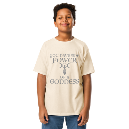 "You have the power of a goddess" printed on a natural youth classic tee worn by a male