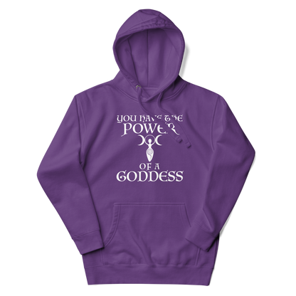 "You have the power of a goddess" printed on a purple unisex hoodie laying on a flat surface with the hood up
