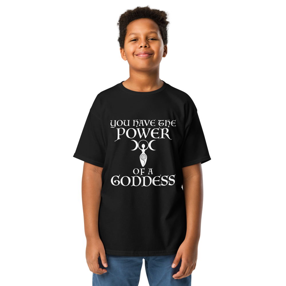 "You have the power of a goddess" printed on a black youth classic tee worn by a male