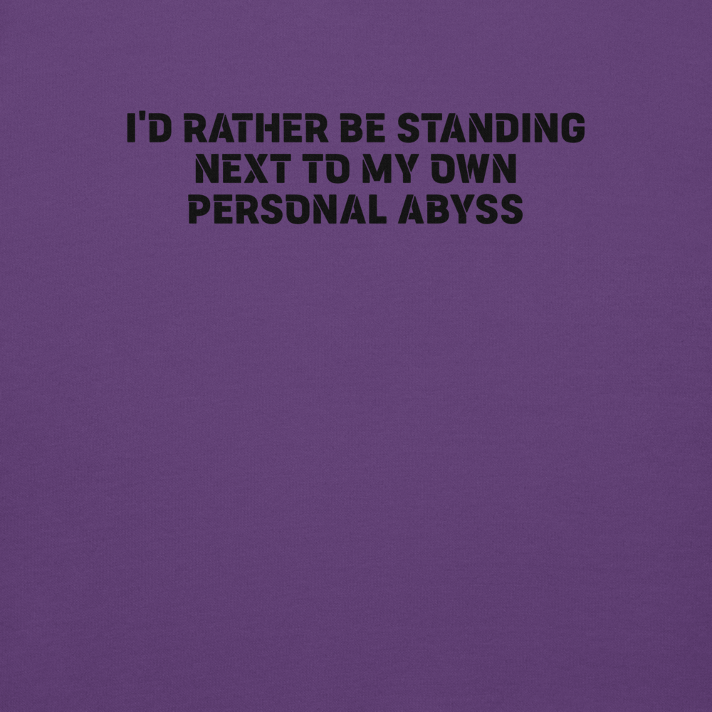 "I'd rather be standing next to my own personal abyss" printed on a purple background