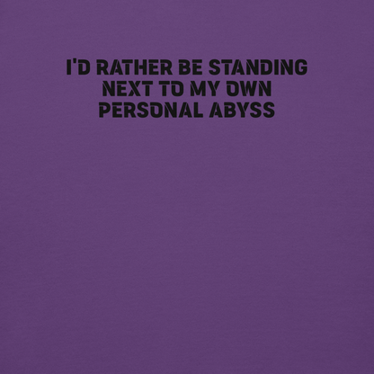"I'd rather be standing next to my own personal abyss" printed on a purple background