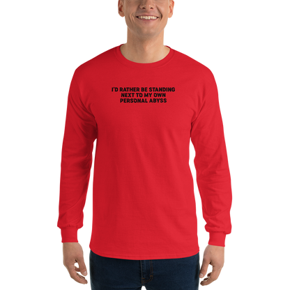 "I'd rather be standing next to my own personal abyss" printed on a red men's long sleeve shirt worn by a male