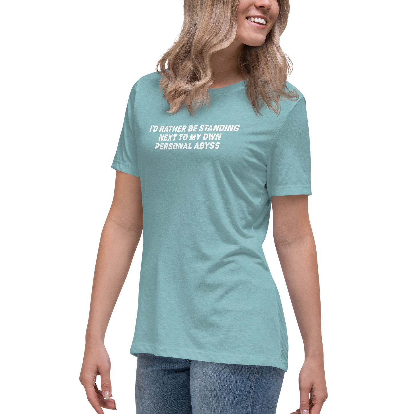 "I'd rather be standing next to my own personal abyss" printed on a heather blue lagoon women's relaxed t-shirt worn by a female