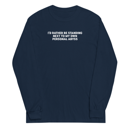 "I'd rather be standing next to my own personal abyss" printed on a navy men's long sleeve shirt laying on a flat surface