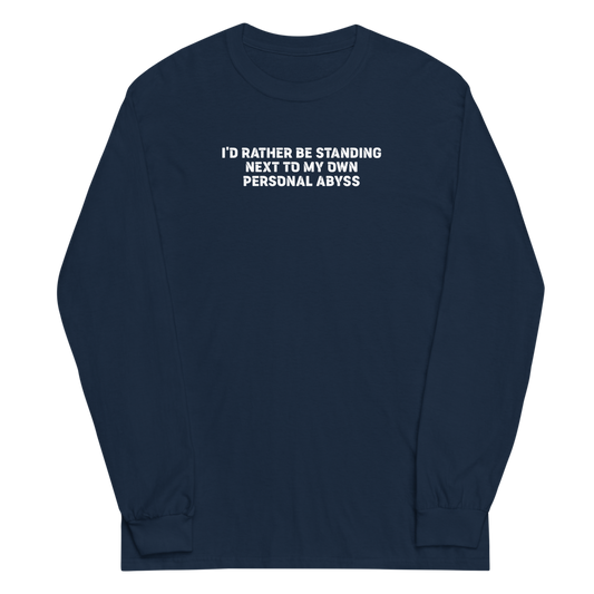 "I'd rather be standing next to my own personal abyss" printed on a navy men's long sleeve shirt laying on a flat surface
