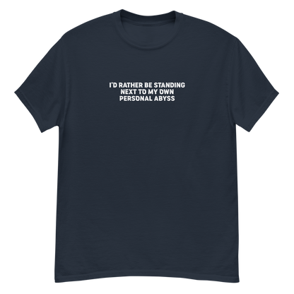 "I'd rather be standing next to my own personal abyss" printed on a navy unisex classic tee laying on a flat surface