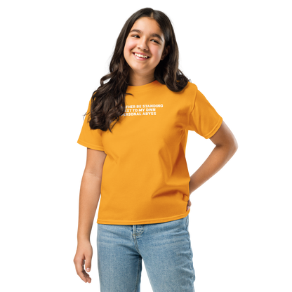 "I'd rather be standing next to my own personal abyss" printed on a gold youth classic tee worn by a female