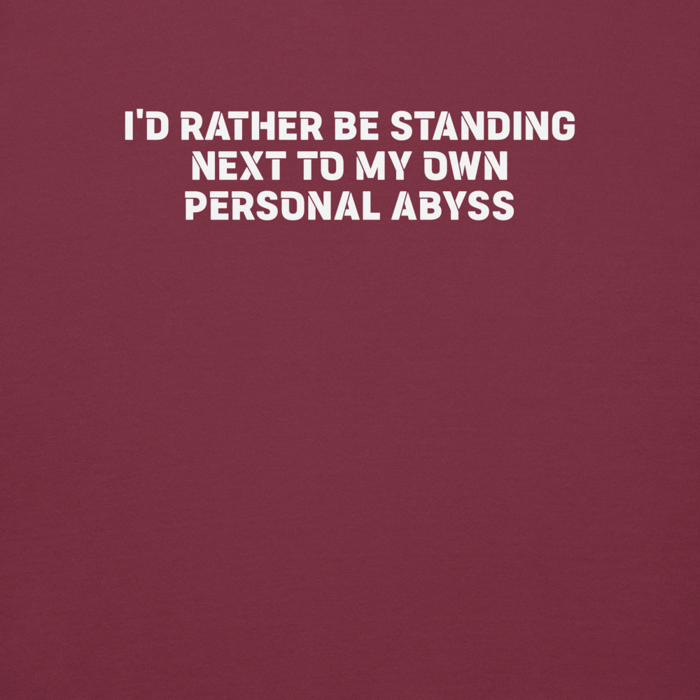 "I'd rather be standing next to my own personal abyss" printed on a maroon background