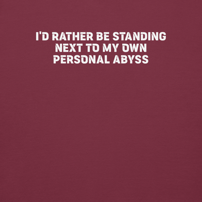 "I'd rather be standing next to my own personal abyss" printed on a maroon background