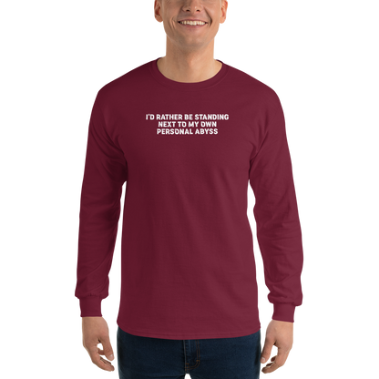 "I'd rather be standing next to my own personal abyss" printed on a maroon men's long sleeve shirt worn by a male