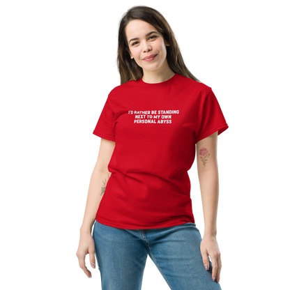 "I'd rather be standing next to my own personal abyss" printed on a red unisex classic tee worn by a female