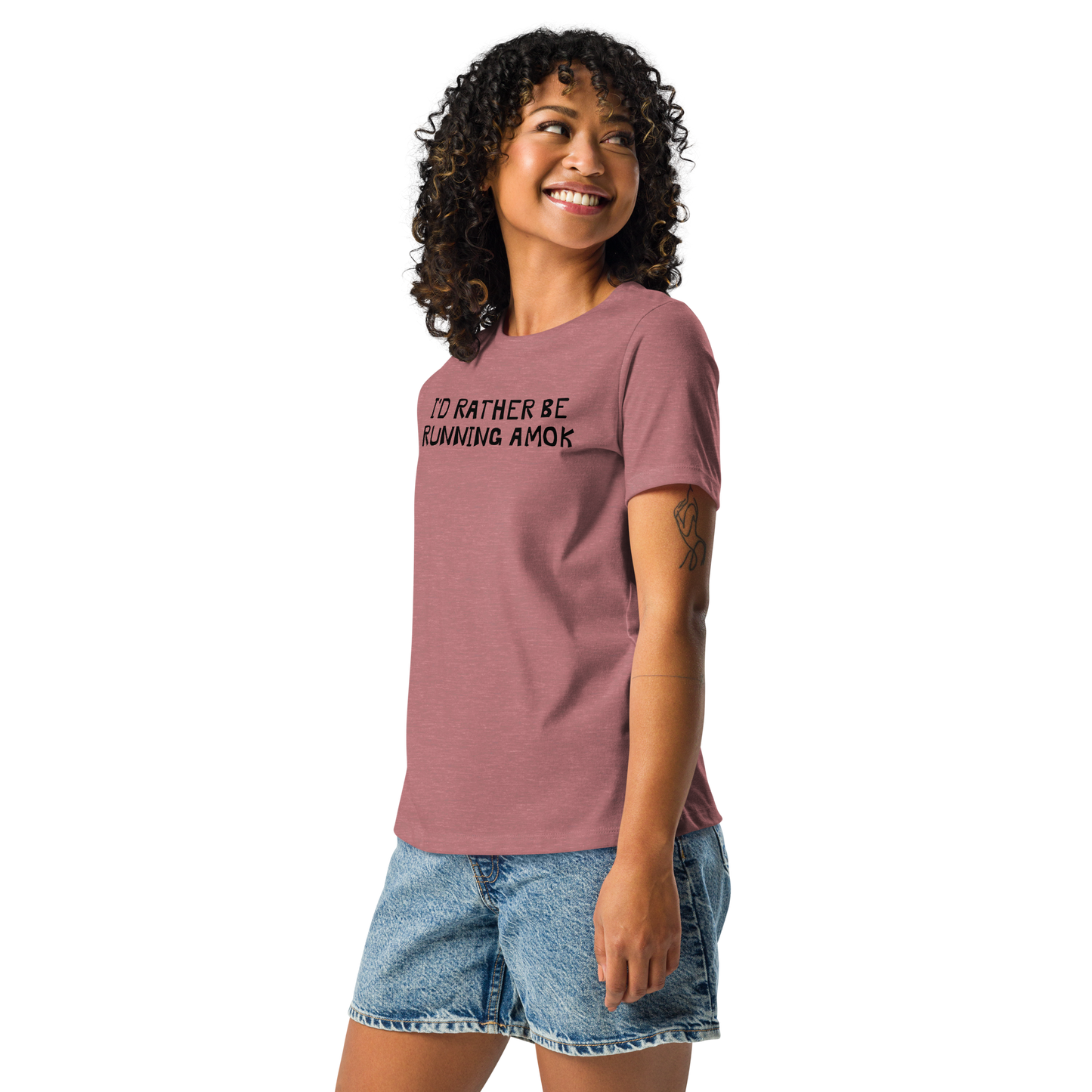 "I’d rather be running amok" printed on a heather mauve women's relaxed t-shirt worn by a female
