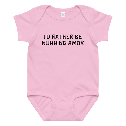 "I’d rather be running amok" printed on a pink baby jersey bodysuit laying on a flat surface amongst other clothes