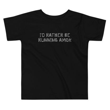 "I’d rather be running amok" printed on a black toddler short sleeve tee laying on a flat surface