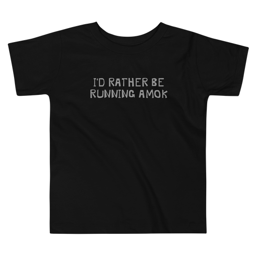 "I’d rather be running amok" printed on a black toddler short sleeve tee laying on a flat surface