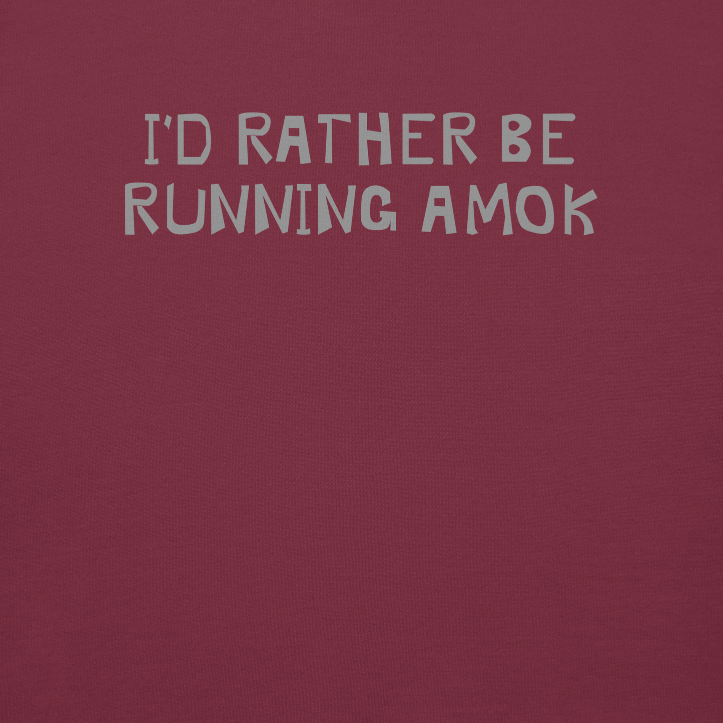 "I’d rather be running amok" printed on a maroon background