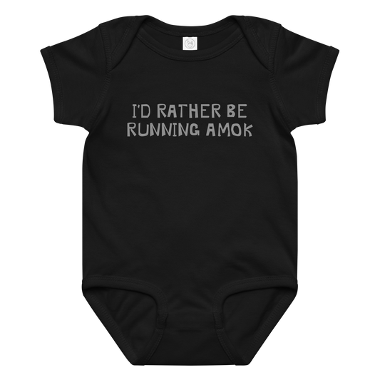 "I’d rather be running amok" printed on a black baby jersey bodysuit laying on a flat surface amongst other clothes