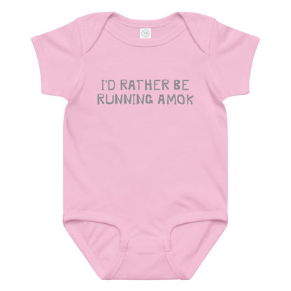 "I’d rather be running amok" printed on a pink baby jersey bodysuit laying on a flat surface amongst other clothes