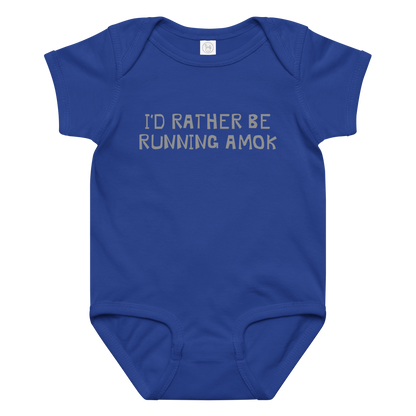 "I’d rather be running amok" printed on a royal baby jersey bodysuit laying on a flat surface amongst other clothes