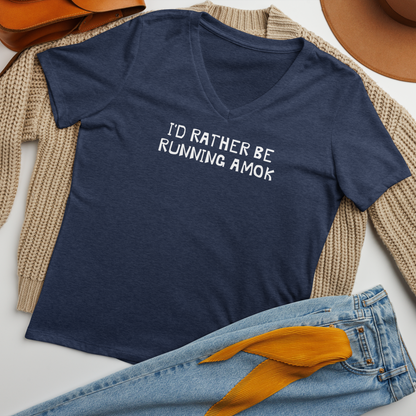 "I’d rather be running amok" printed on a heather navy women's relaxed v-neck t-shirt laying on a flat surface amongst other clothes