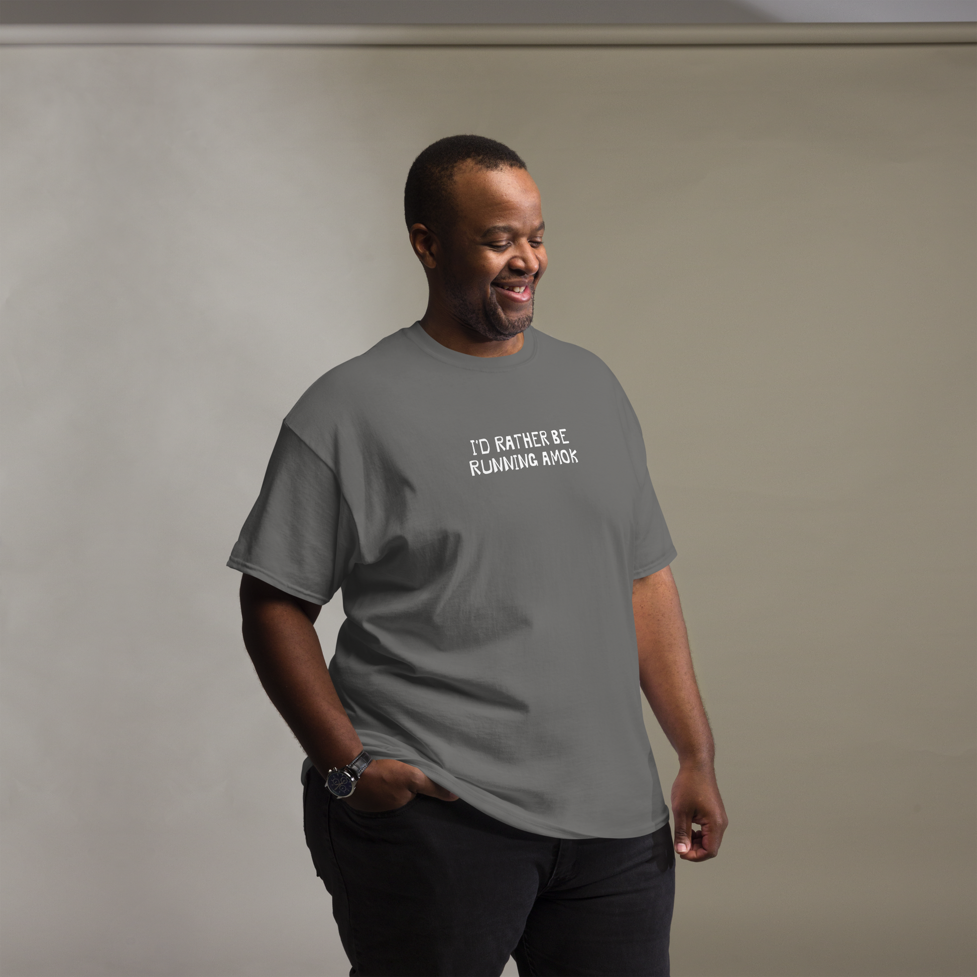 "I’d rather be running amok" printed on a charcoal unisex classic tee worn by a male