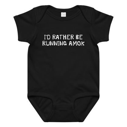 "I’d rather be running amok" printed on a black baby jersey bodysuit laying on a flat surface amongst other clothes
