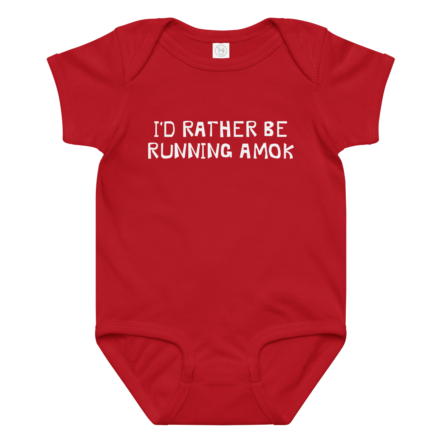 "I’d rather be running amok" printed on a red baby jersey bodysuit laying on a flat surface amongst other clothes