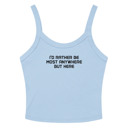 "I’d rather be most anywhere but here" printed on a solid baby blue blend women's micro-rib tanktop laying on a flat surface amongst sunglasses and shorts