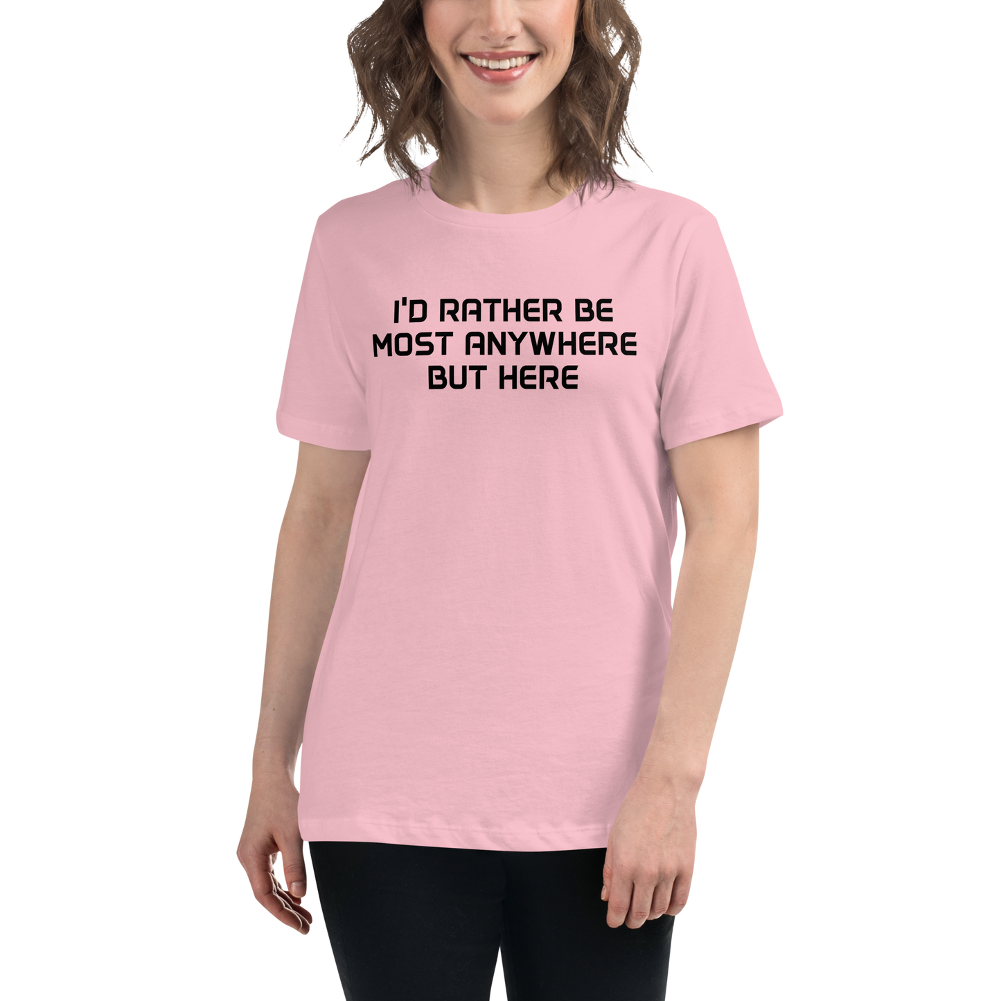 "I’d rather be most anywhere but here" printed on a pink women's relaxed t-shirt worn by a female
