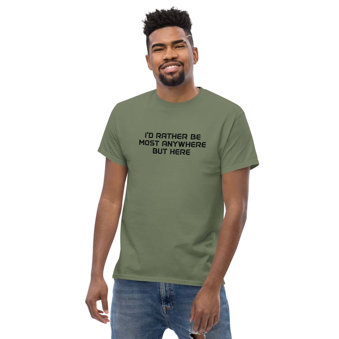 "I’d rather be most anywhere but here" printed on a military green unisex classic tee worn by a male