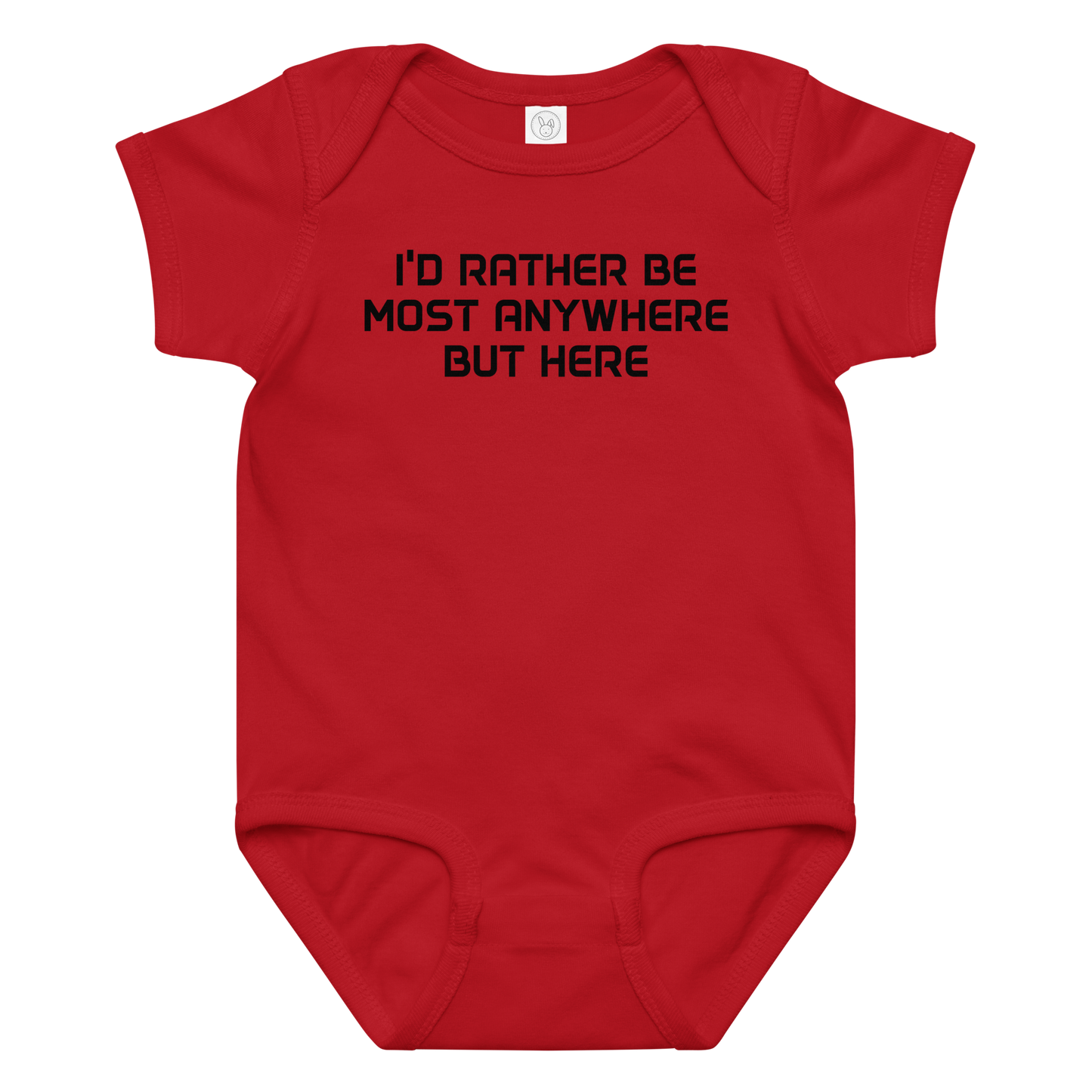 "I’d rather be most anywhere but here" printed on a red baby jersey bodysuit laying on a flat surface amongst other clothes