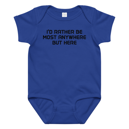 "I’d rather be most anywhere but here" printed on a royal baby jersey bodysuit laying on a flat surface amongst other clothes