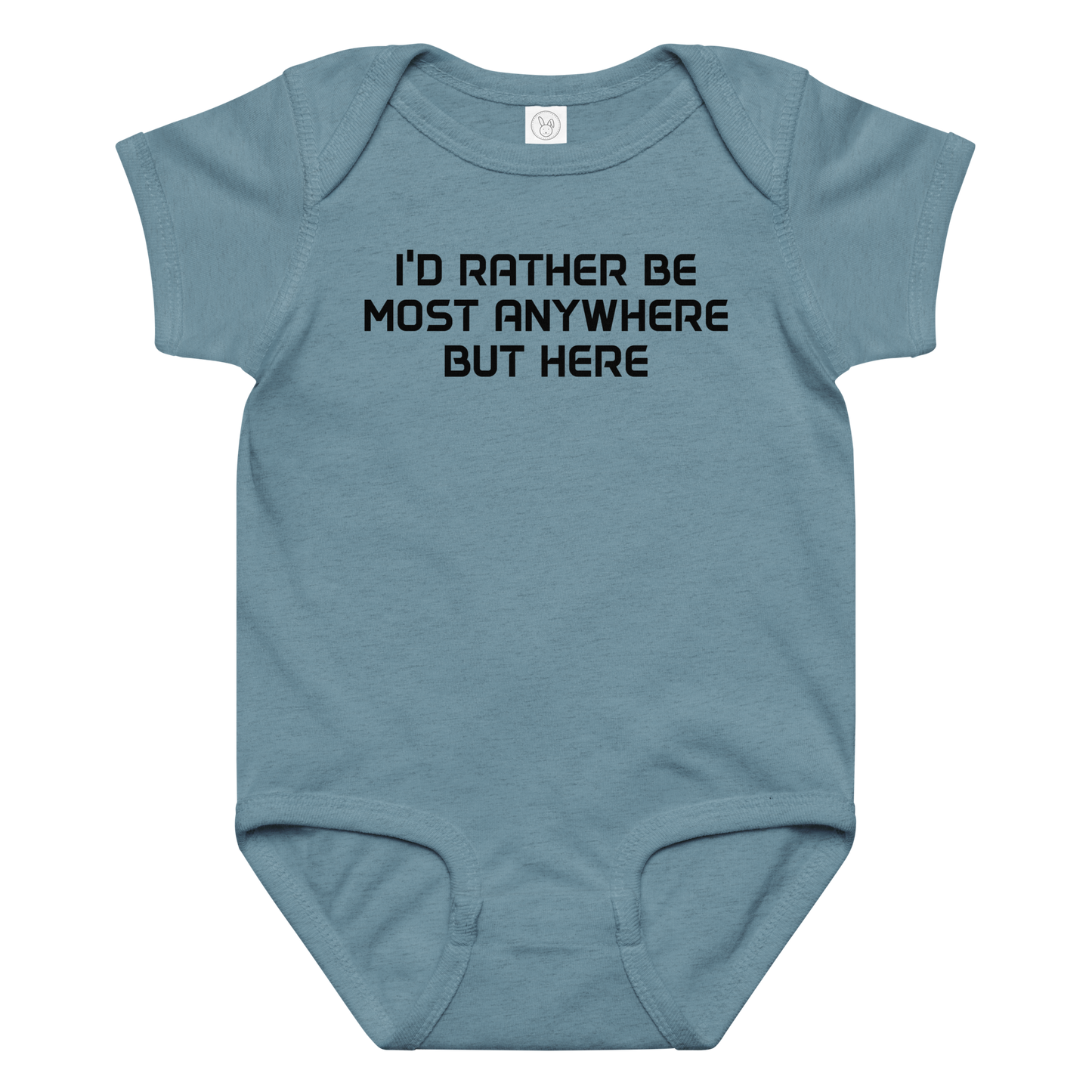 "I’d rather be most anywhere but here" printed on a vintage indigo baby jersey bodysuit laying on a flat surface amongst other clothes