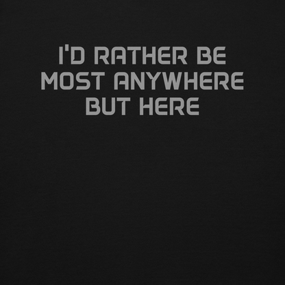 "I’d rather be most anywhere but here" printed on a black background