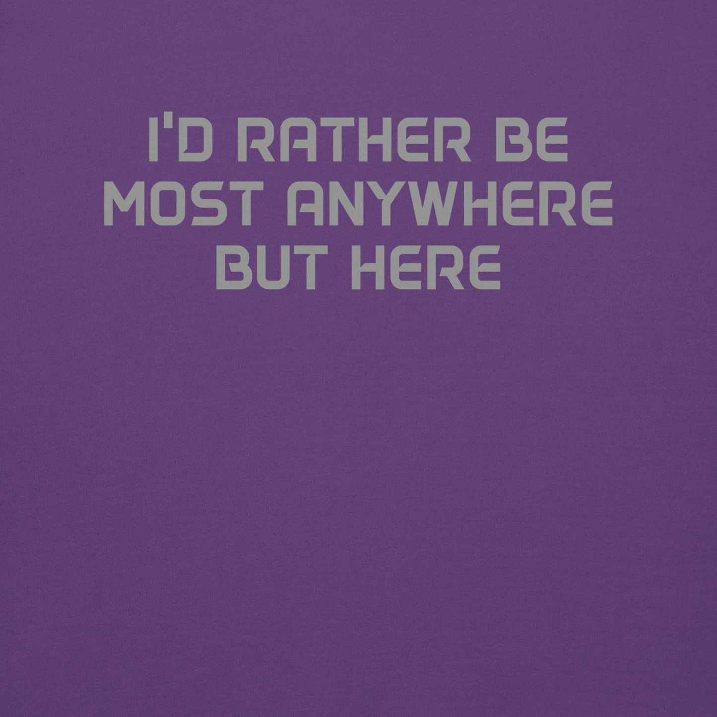 "I’d rather be most anywhere but here" printed on a purple background